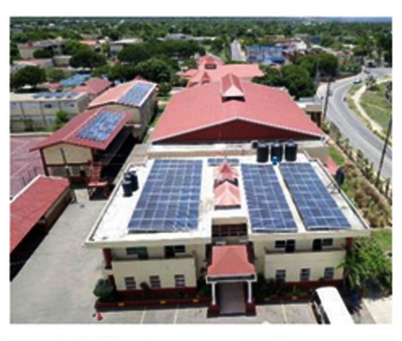 Principal Dwight Pennycooke with smart screens paid from solar savings to equip all labs